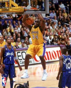 Shaquille O'Neal dunks the ball